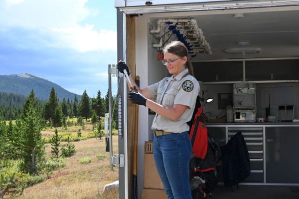 Using a mobile laboratory, Dr. Tawni Firestone runs water samples from the project treatment area directly through a High-Performance Liquid Chromatography (HPLC) instrument.