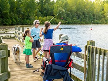 anglers of all ages fishing off pier