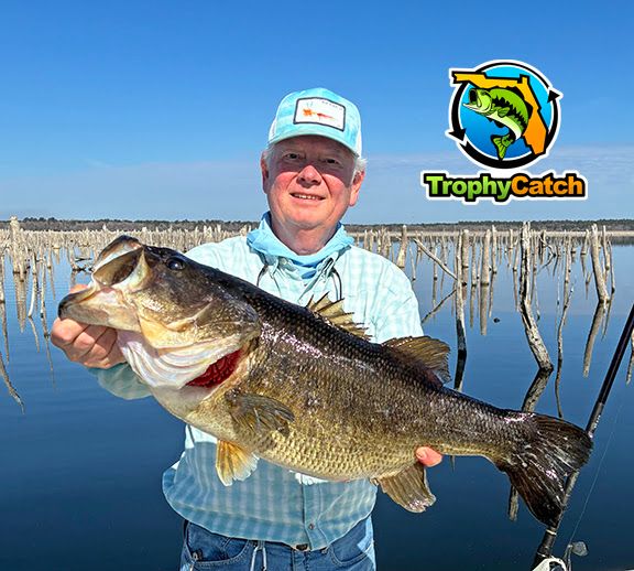 Angler with trophy Florida bass, TrophyCatch logo