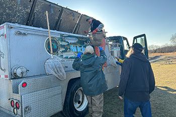 Fish stocking at Spring Mill Pond (Island Lake Recreation Area, Livingston County)