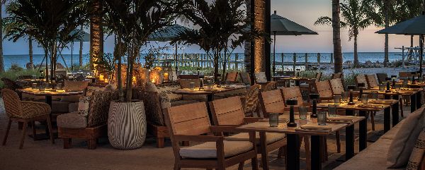 A table and chairs in a restaurantAI-generated content may be incorrect.