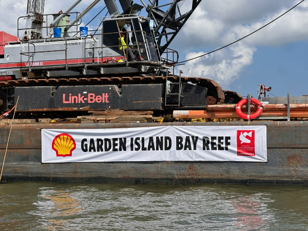 barge with crane for placement of reef