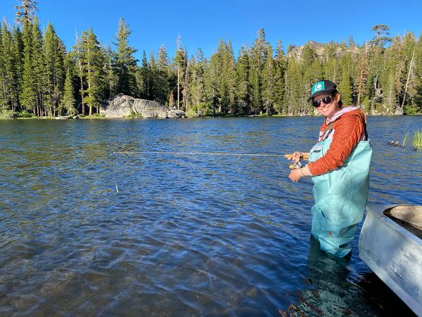 Woman fishing in lake. CDFW photo