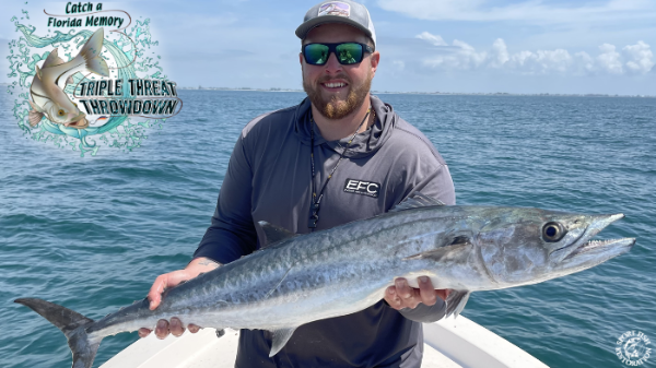 CAFM CAFM_Person holding King Mackeral